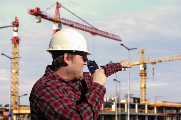 High rise construction worker using RCA two-way radios