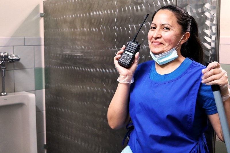 Professional cleaner using two-way radios
