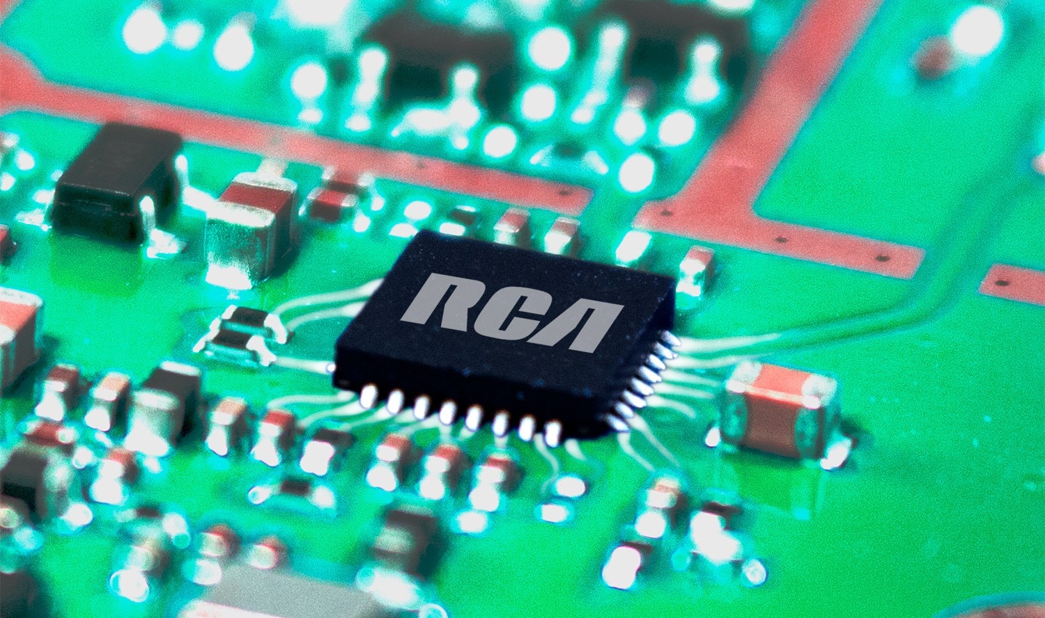An RCA-branded microchip is attached to the circuitry inside an RCA two-way radio.